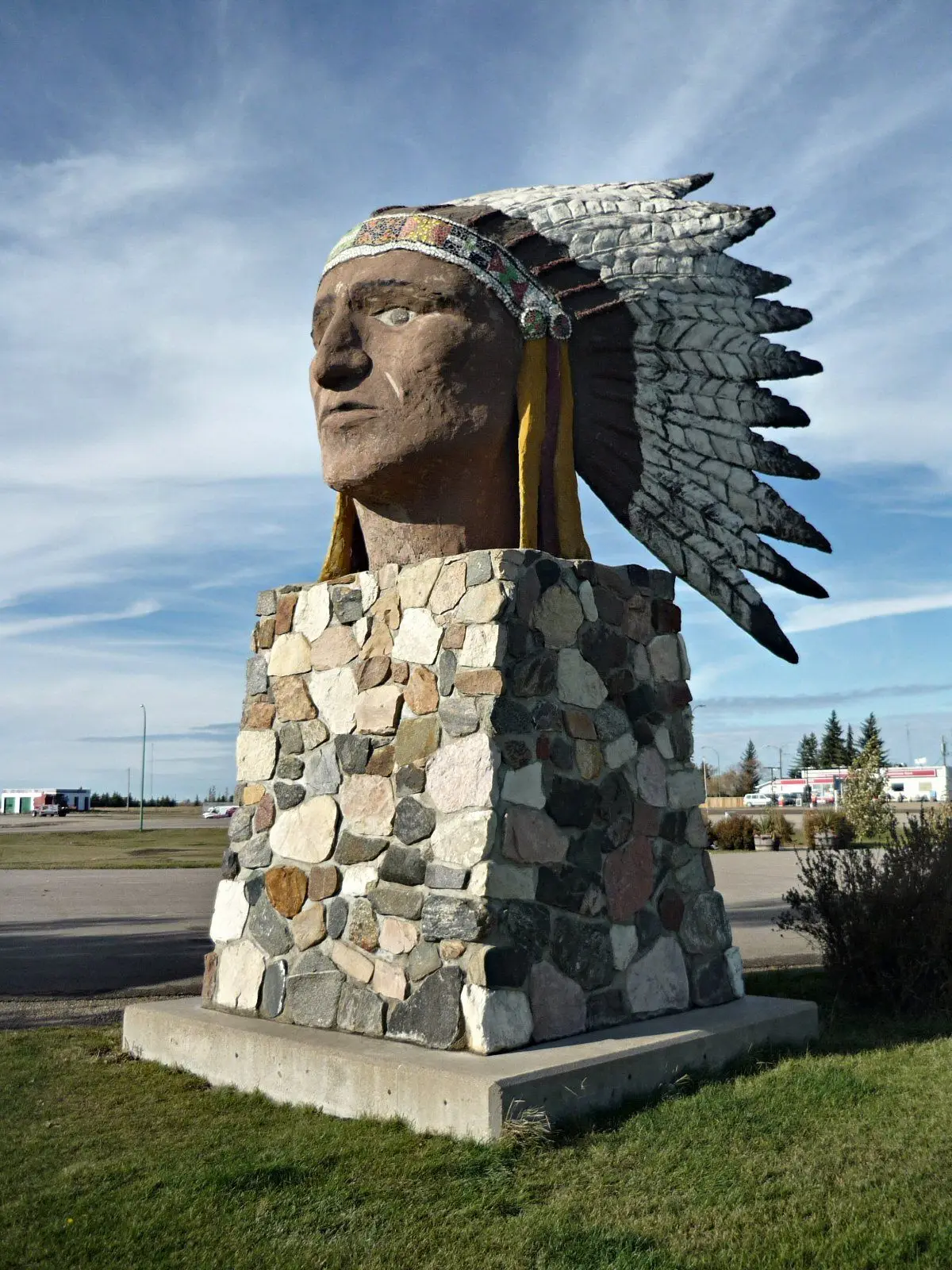 Indian Head monument statue on stone base